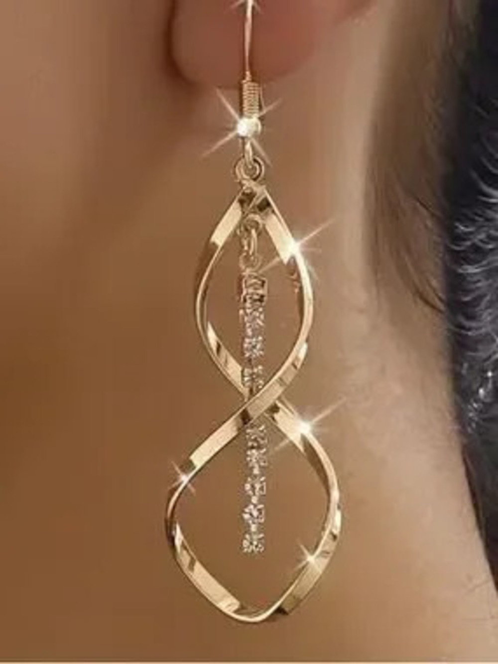 Gold Tone Twisted Infinity Drop Earrings with Crystal Accent